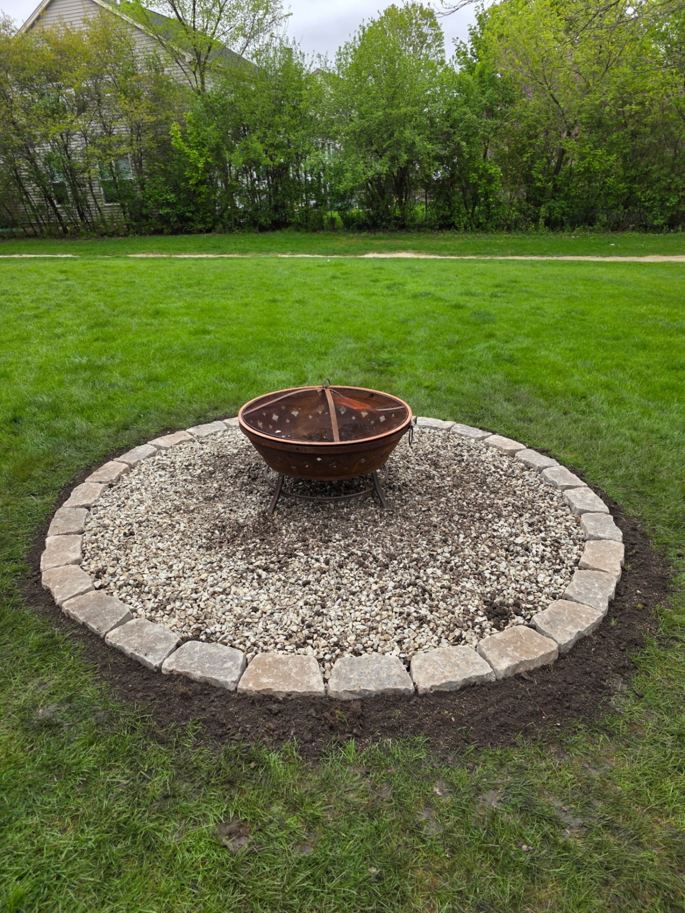 Backyard fire pit gathering circle